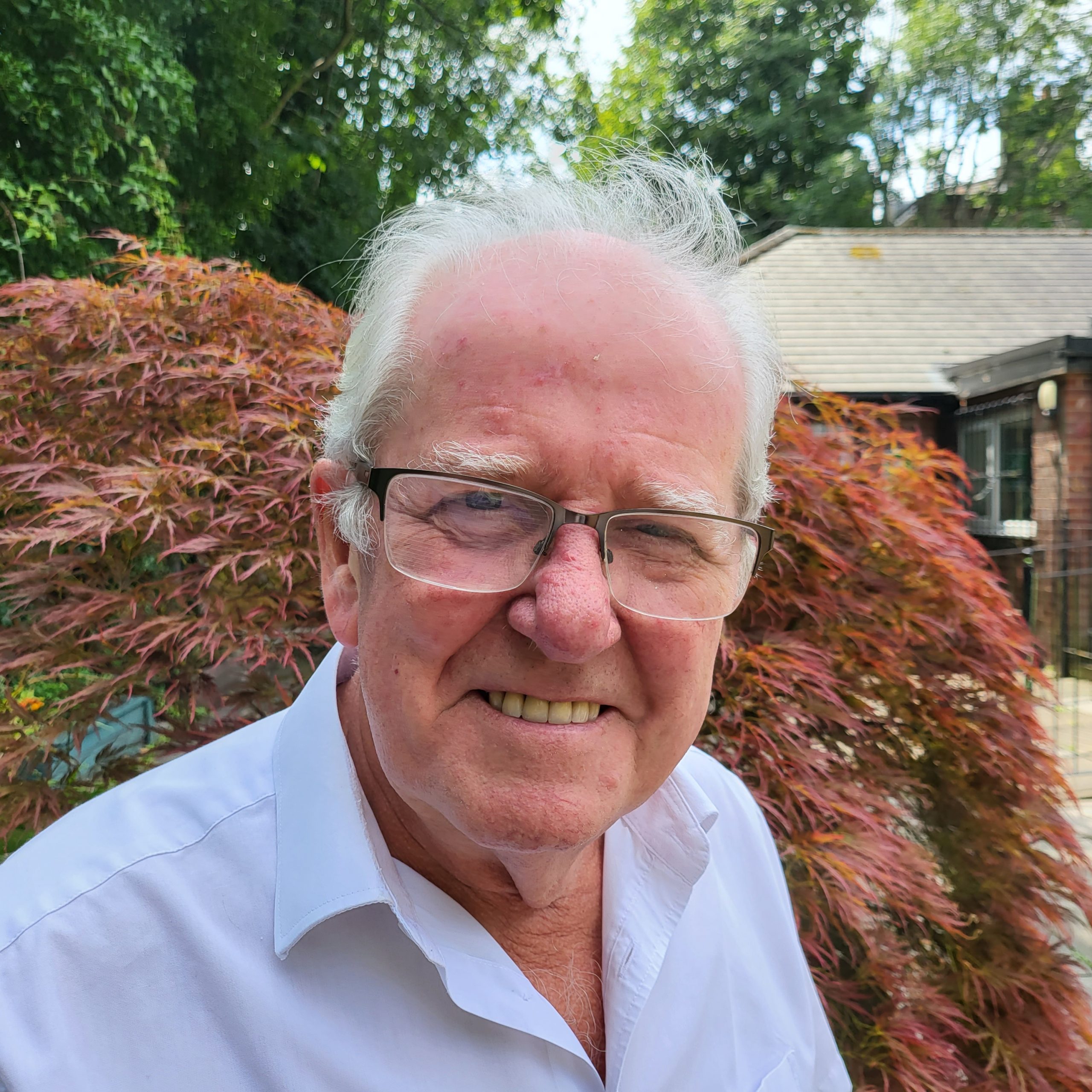 Three of our members enjoying taking part in a painting class.