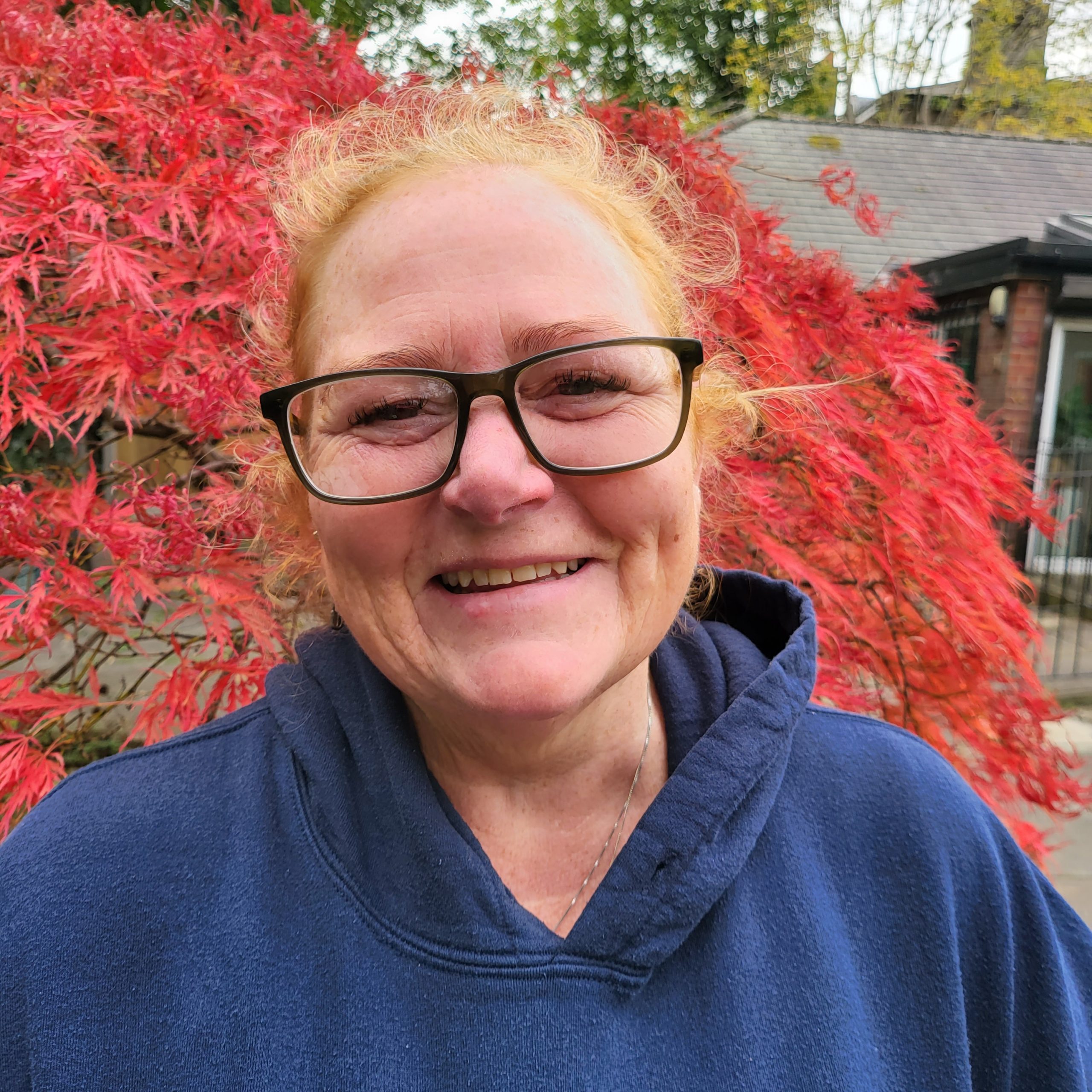 Three of our members enjoying taking part in a painting class.