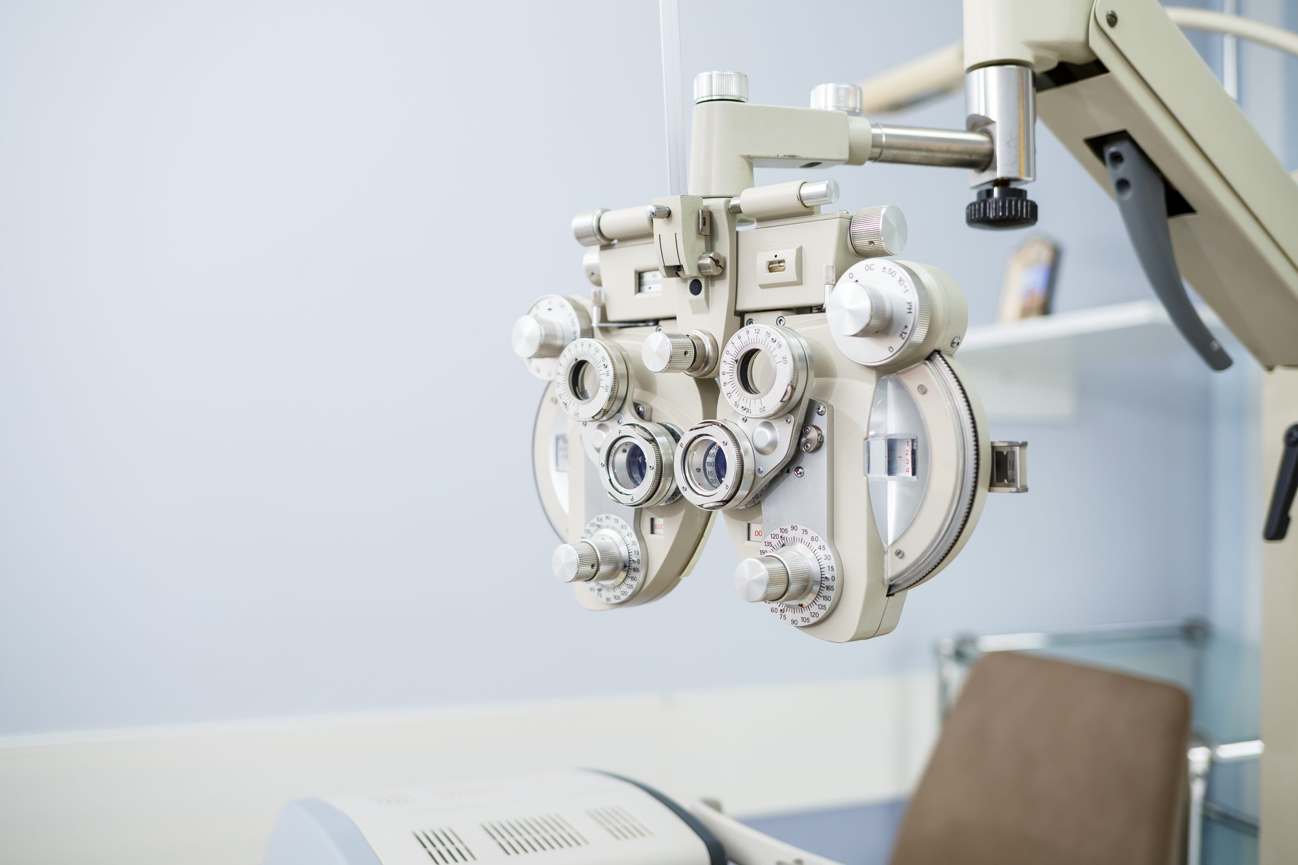 Microscopic apparatus for testing eyesight. Ophthalmology and treatment of eye diseases A piece of medical equipment used for testing eyesight. The apparatus has several dials on the front, and two eyepieces for a patient to look through.